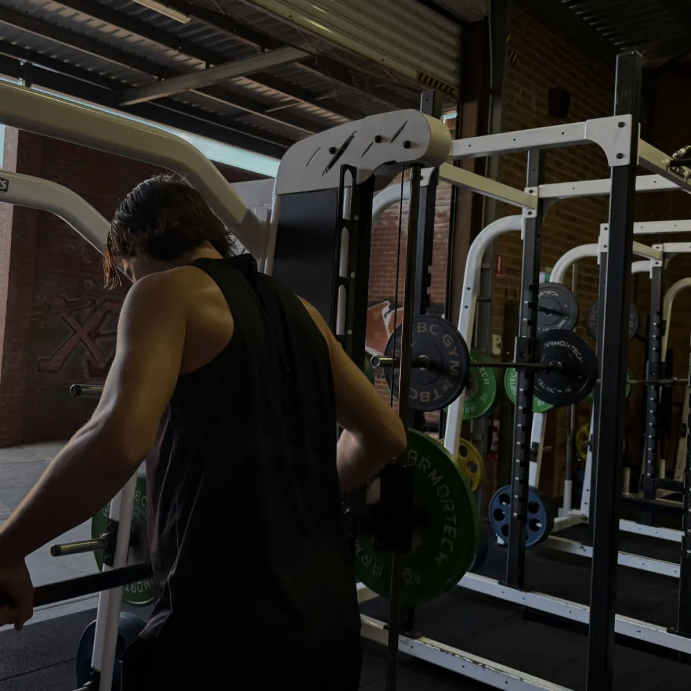 Member training on the cable machine at Tribe Wellness Co